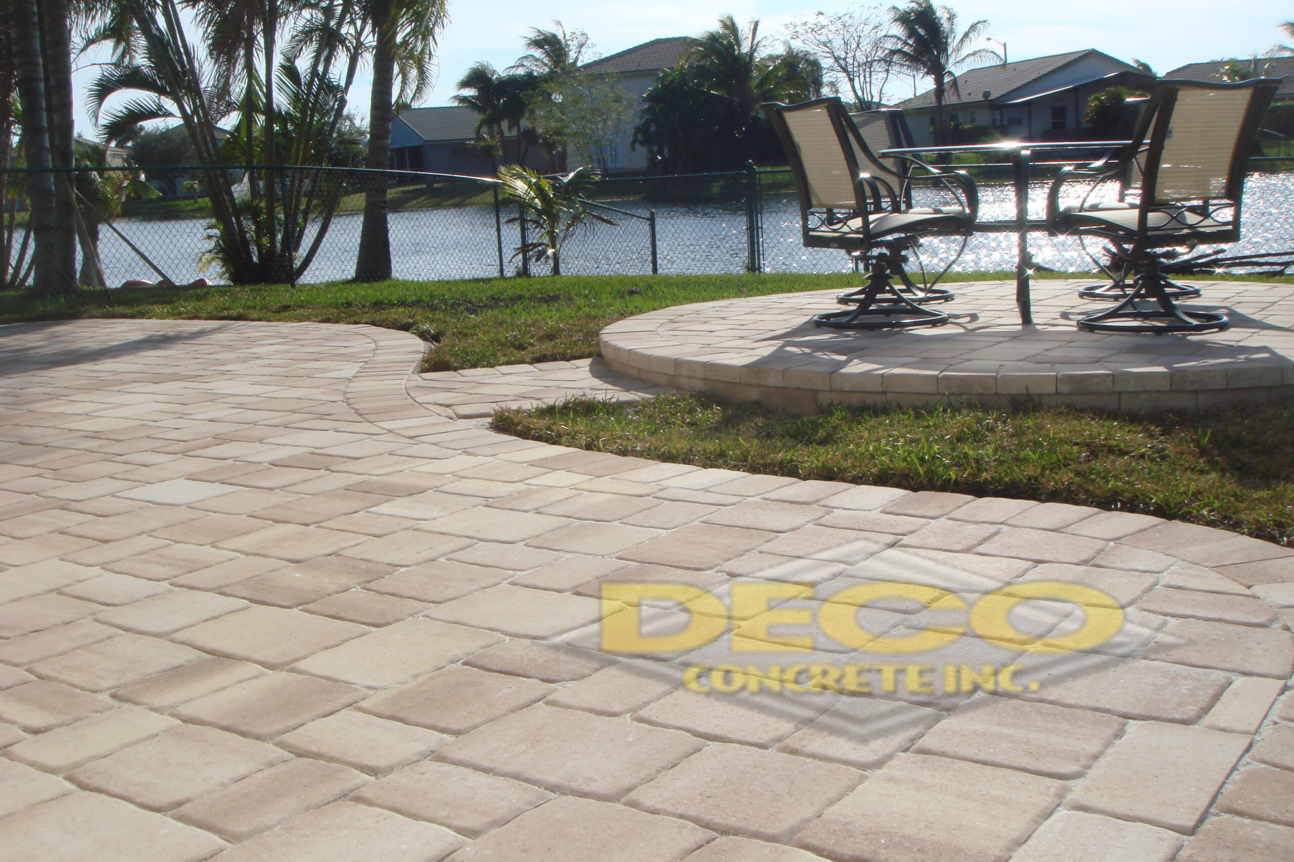 Brick Pavers Near Table & Chairs and Canal in Fort Lauderdale, FL