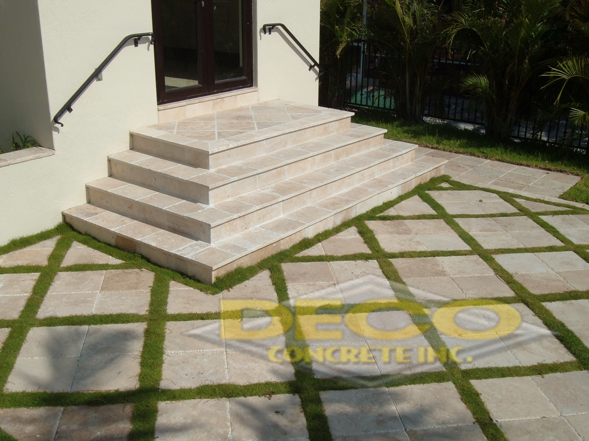 Natural Stone Pavers Near Steps with Artificial Turf in Fort Lauderdale, FL